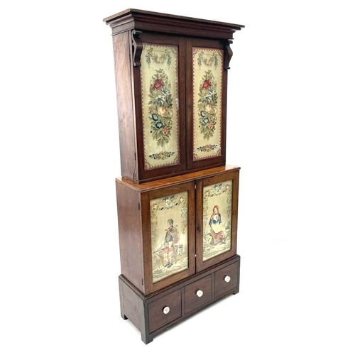 613 - A 19th century walnut and mahogany bookcase. With embroidered panels enclosing various shelves, the ... 