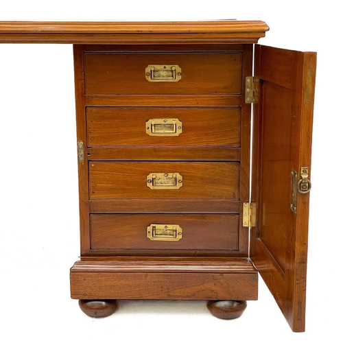 615 - A teak partners desk. Indian, mid 20th century, with a rexine writing surface, each pedestal fitted ... 