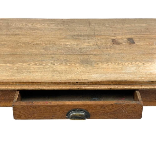 617 - An oak table or writing desk. 20th century, fitted a single drawer and raised on square legs, height... 