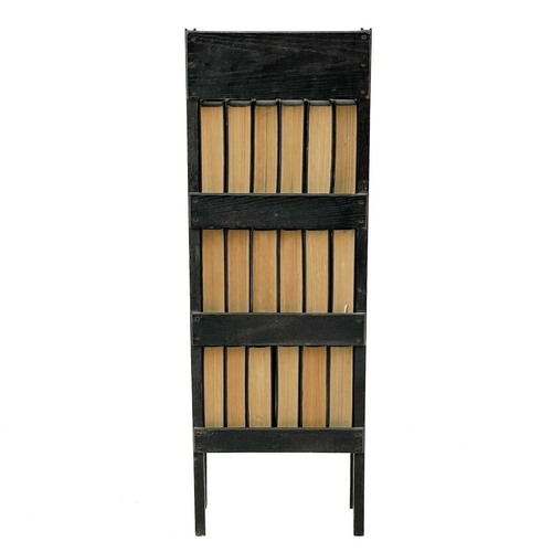 622 - A stained oak narrow bookcase. With three shelves, fitted 18 volumes of Charles Dickens Library, hei... 