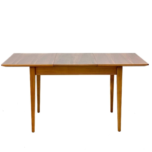 631 - A Gordon Russell Broadway beech and walnut dining table and five chairs. Table 76.5cm extended 153cm... 