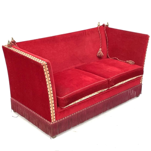 634 - An upholstered two seater Knole type settee. Height 79cm width 140cm depth 71cm.