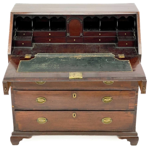 650 - A George III mahogany bureau. With a well fitted interior of stepped drawers, pigeon holes and compa... 