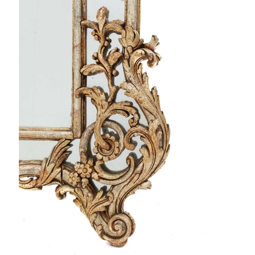 655 - A large gilt wood rococo style overmantle mirror. Carved with foliate scrolls, height 167cm width 15... 