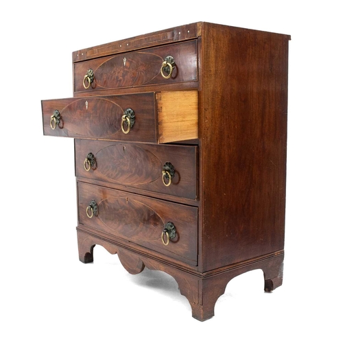 659 - A George III mahogany and inlaid chest of four graduated long drawers. With oval inlaid panels and f... 