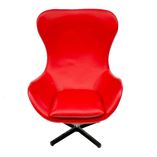 663 - After Arne Jacobsen swivel egg chair. In red leather, height 120cm width 82cm.