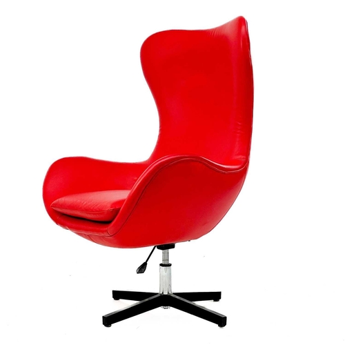 663 - After Arne Jacobsen swivel egg chair. In red leather, height 120cm width 82cm.