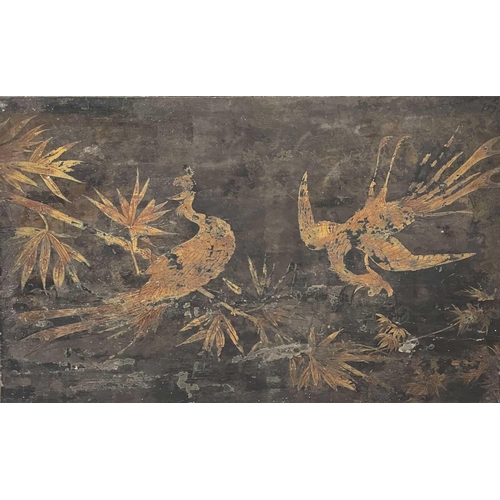 667 - A lacquered table in the Chinoiserie taste. 19th century, the top decorated with gilt ho ho birds ab... 