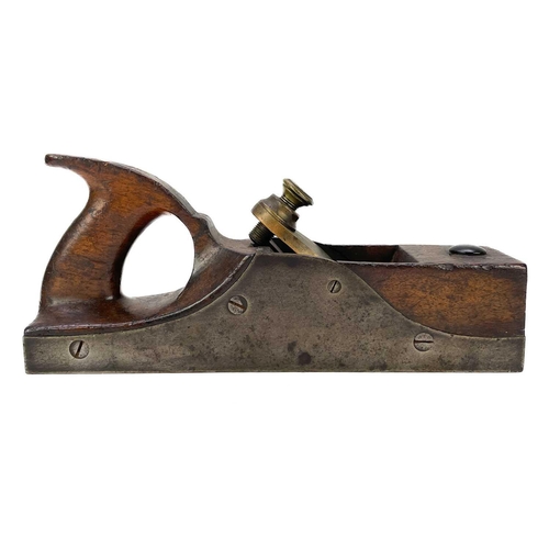 67 - A steel framed woodworking plane. With brass tongue, length 28cm.