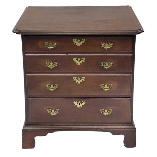 676 - An early George III mahogany small chest. Of four long drawers, the top with moulded edge and re-ent... 