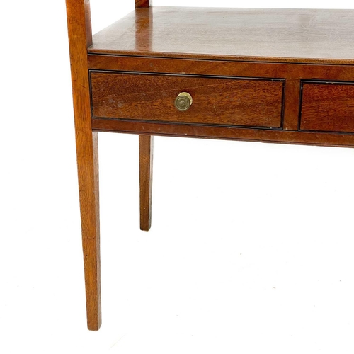 677 - A 19th century mahogany two tier side table. With two short drawers on square tapering supports, hei... 