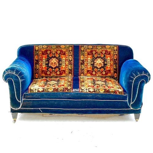 679 - A late Victorian mahogany framed drop-end settee and two armchairs. All with matching carpet upholst... 