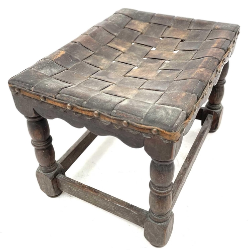 681 - An early 20th century oak stool. With latticework leather straps, height 27cm.