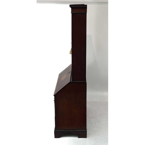 682 - A George III mahogany and satin wood crossbanded bureau bookcase. The upper section with astragal gl... 