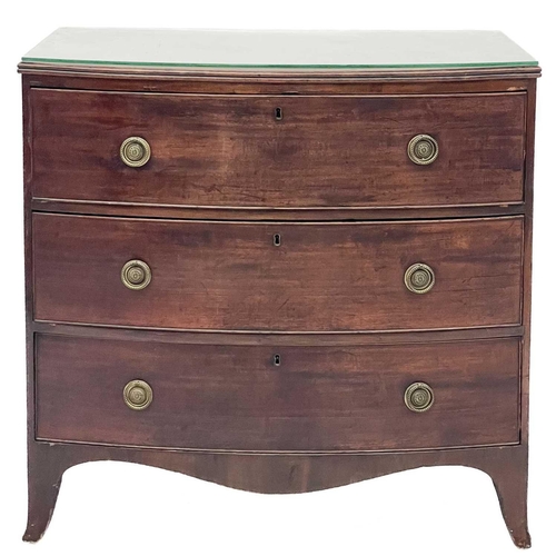 685 - A late George III mahogany bow front chest. With three long drawers on splayed bracket feet, height ... 