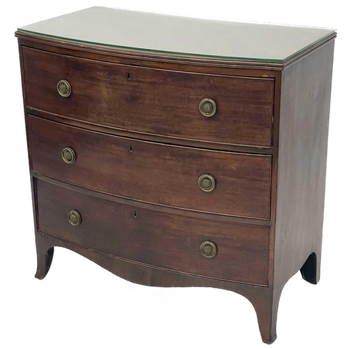 685 - A late George III mahogany bow front chest. With three long drawers on splayed bracket feet, height ... 