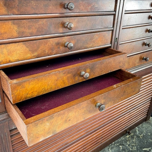 686 - A late Victorian walnut dentist's cabinet. With a galleried top above ten graduated drawers with a t... 