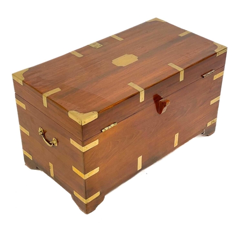 689 - A brass bound teak campaign style small chest. 20th century, with twin brass handles and bracket fee... 