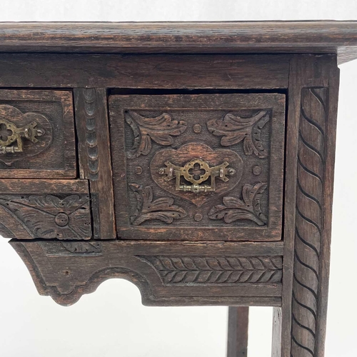 695 - A late Victorian carved oak side table. Fitted three drawers on square chamfered legs, height 71cm, ... 