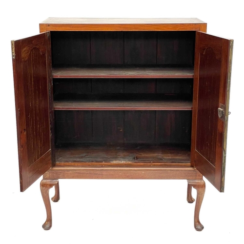 698 - A 19th century mahogany cabinet on stand. With a well figured crossbanded top, the twin doors open t... 