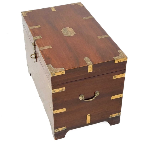 704 - A brass bound teak campaign style small chest. 20th century, with twin brass handles and bracket fee... 