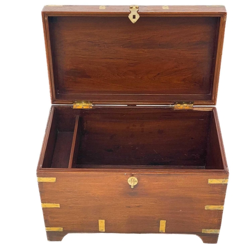 704 - A brass bound teak campaign style small chest. 20th century, with twin brass handles and bracket fee... 