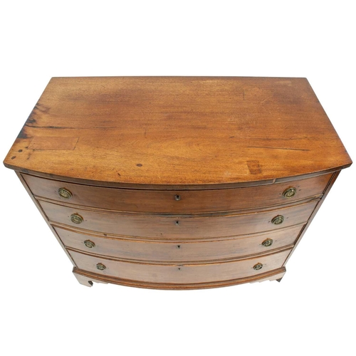 709 - A late George III mahogany bow front chest. Fitted four graduated long drawers, on bracket feet, hei... 