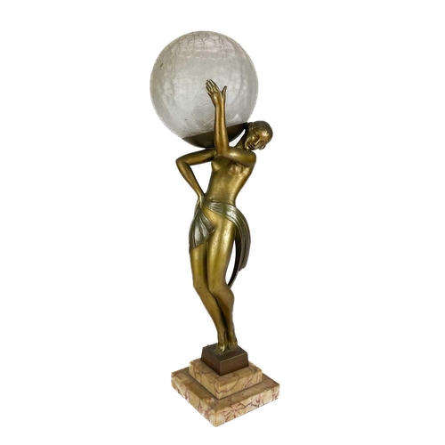 71 - An Art Deco patinated spelter figural table lamp after Faguays by Fayral. On a stepped marble base, ... 