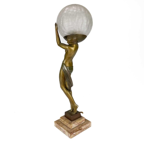 71 - An Art Deco patinated spelter figural table lamp after Faguays by Fayral. On a stepped marble base, ... 