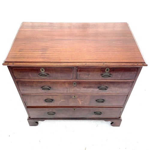 710 - A George III mahogany chest. Of two short and three long drawers, with boxwood and ebony stringing, ... 