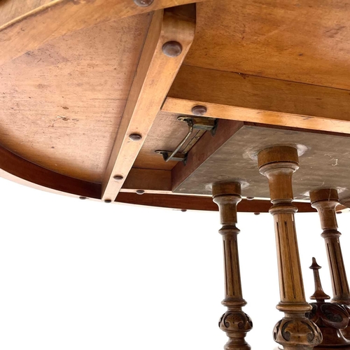 720 - A Victorian burr walnut oval loo table. With a quarter veneered top with boxwood stringing and inlay... 