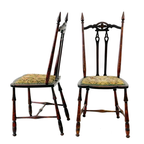 721 - A set of three mahogany Arts and Crafts chairs. Circa 1900, with pierced foliate and reverse spade m... 