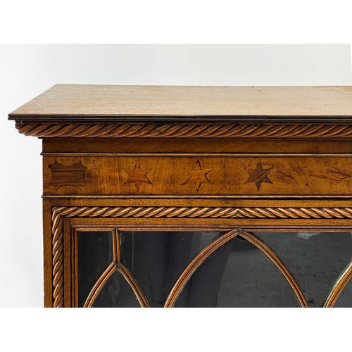 728 - A 19th century mahogany bookcase. With twin astragal glazed doors below inlaid star frieze, carved r... 