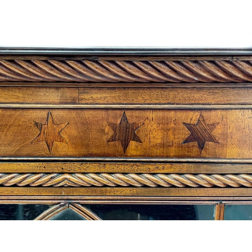 728 - A 19th century mahogany bookcase. With twin astragal glazed doors below inlaid star frieze, carved r... 