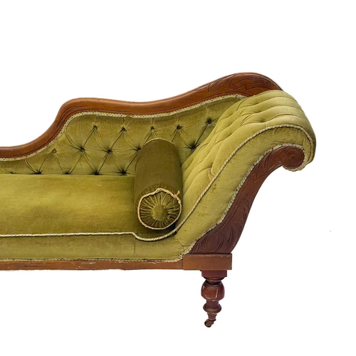 742 - A late Victorian beech frame chaise longue. With button back upholstery on turned supports and brass... 