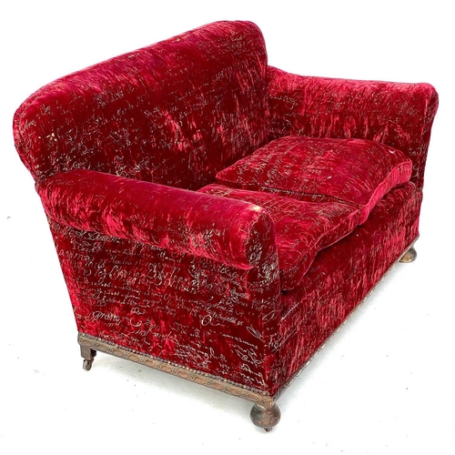 750 - An early 20th century upholstered settee. With carved details on bun feet, height 81cm width 146cm d... 