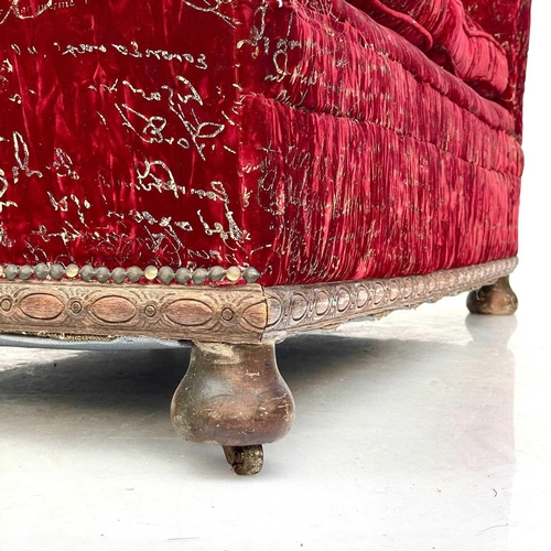 750 - An early 20th century upholstered settee. With carved details on bun feet, height 81cm width 146cm d... 