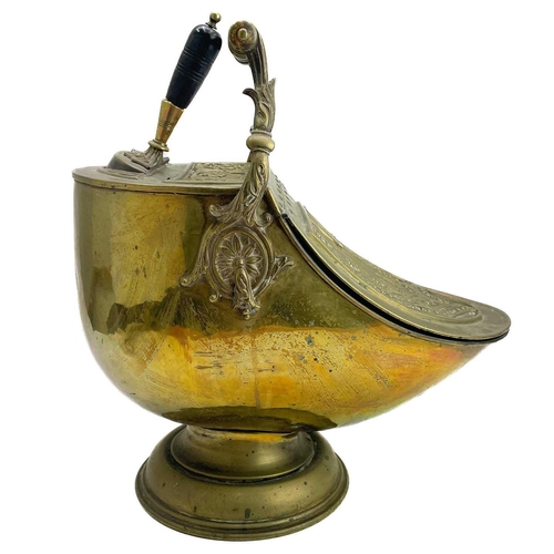 76 - A late Victorian Neo-Classical style brass coal scuttle. With lift-up lid and turned and ebonised ha... 