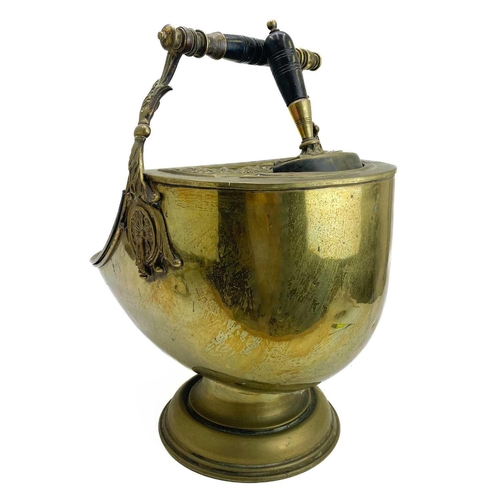 76 - A late Victorian Neo-Classical style brass coal scuttle. With lift-up lid and turned and ebonised ha... 