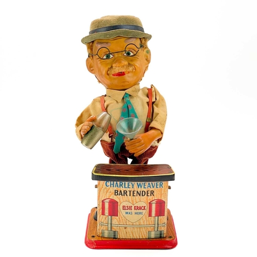 96 - A Japanese tinplate bartender figure. 'Charley Weaver', with battery operated movement, height 30cm,... 