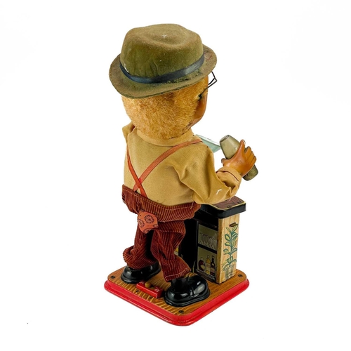 96 - A Japanese tinplate bartender figure. 'Charley Weaver', with battery operated movement, height 30cm,... 