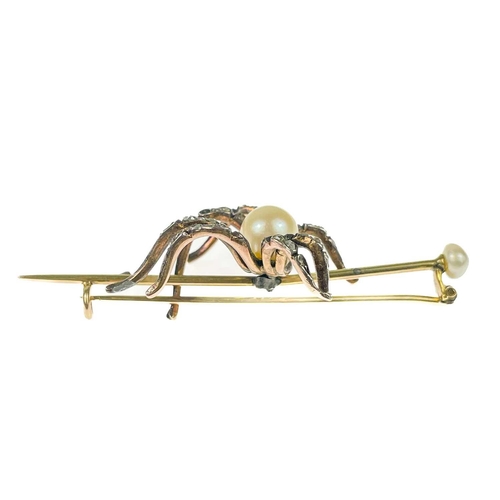 186 - A Victorian gold diamond and pearl set spider bar brooch. The applied spider with pearl body and sev... 
