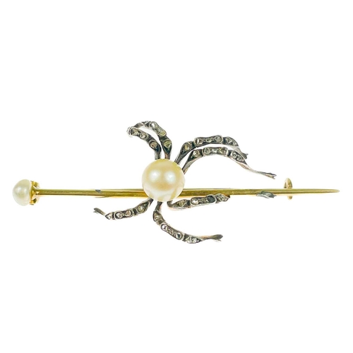186 - A Victorian gold diamond and pearl set spider bar brooch. The applied spider with pearl body and sev... 