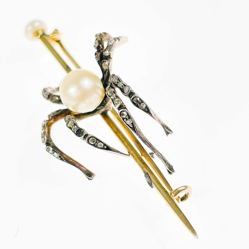 186 - A Victorian gold diamond and pearl set spider bar brooch. The applied spider with pearl body and sev... 