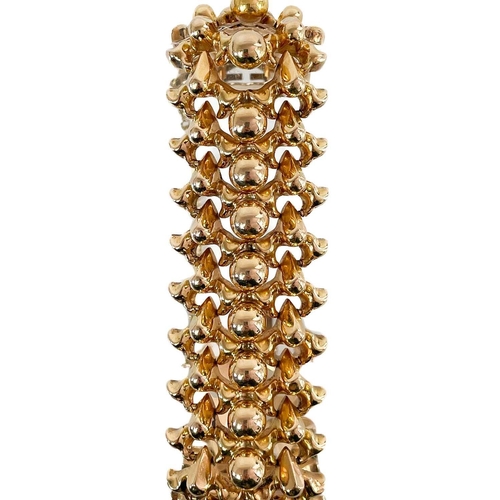 201 - A good Continental high purity gold (tests 18ct) fancy link bracelet. With concealed clasp and safet... 