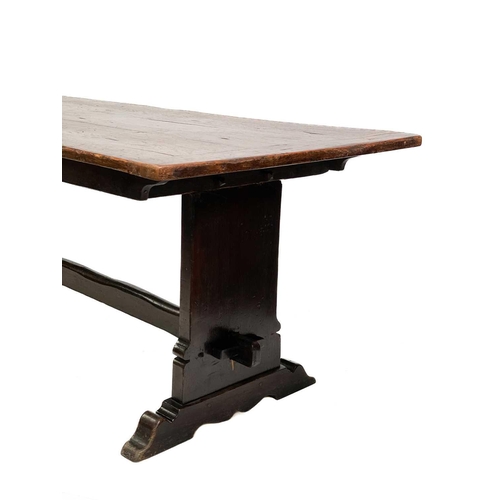 23 - An 18th century oak refectory table. With a rectangle plank top twin trestle supports on sledge feet... 
