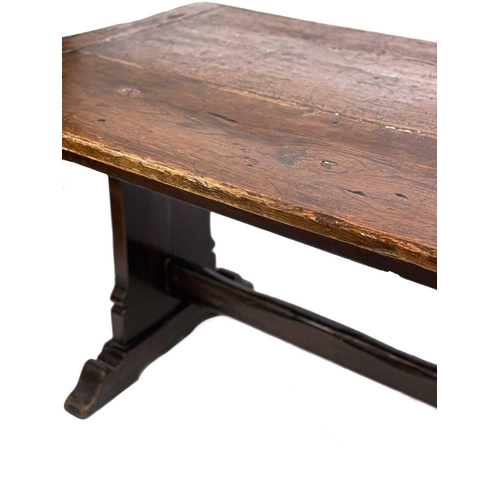 23 - An 18th century oak refectory table. With a rectangle plank top twin trestle supports on sledge feet... 