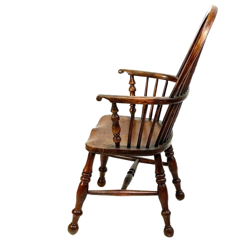 37 - A yew and ash Windsor armchair. 19th century, with a pierced vase splat, on a turned underframe, hei... 