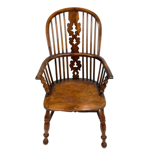 37 - A yew and ash Windsor armchair. 19th century, with a pierced vase splat, on a turned underframe, hei... 