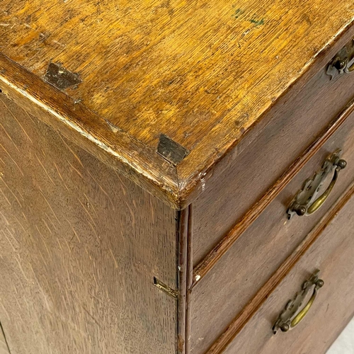 38 - A George III oak chest of drawers. With two short and three long drawers on bracket feet, height 88c... 